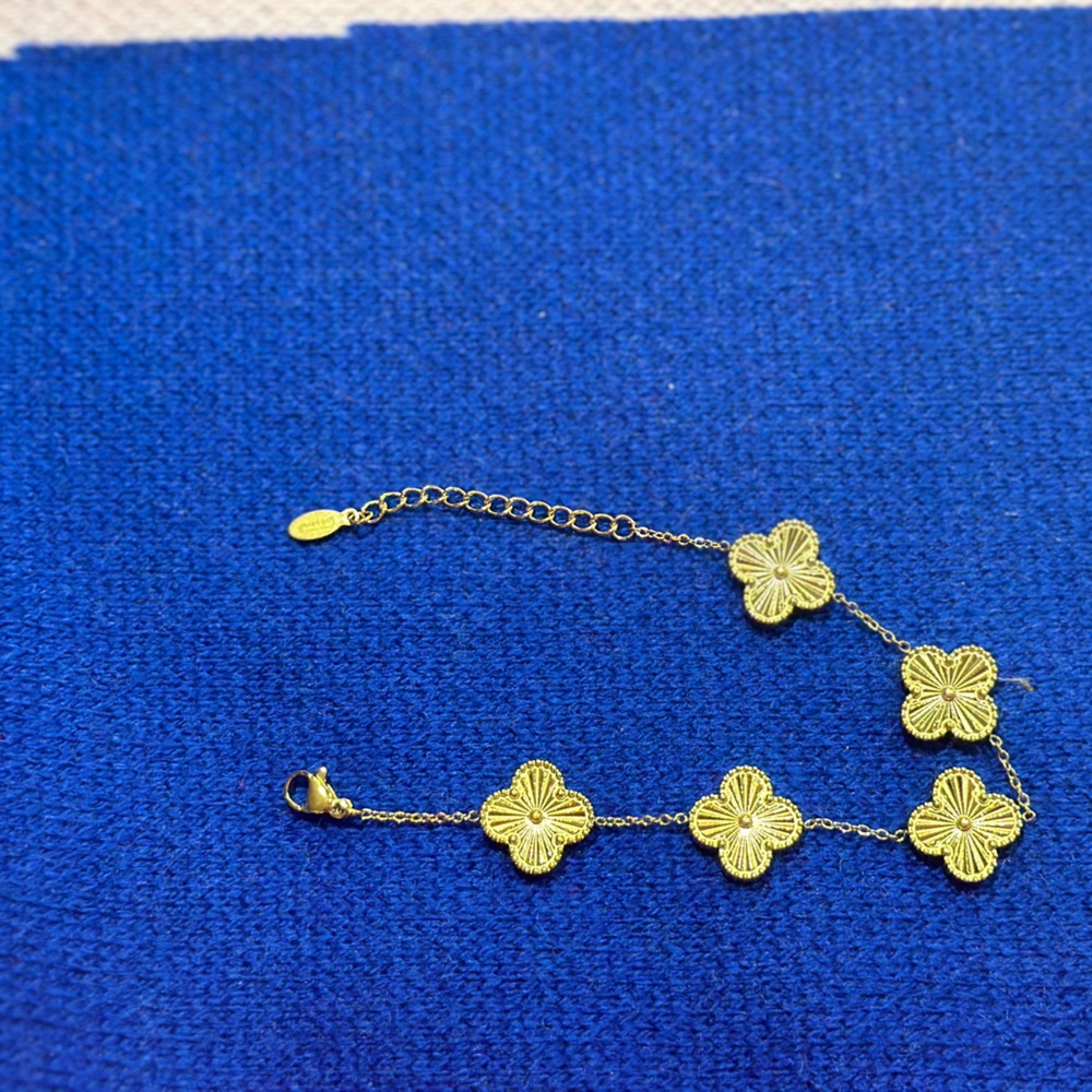 Gold clover bracelet . New never used